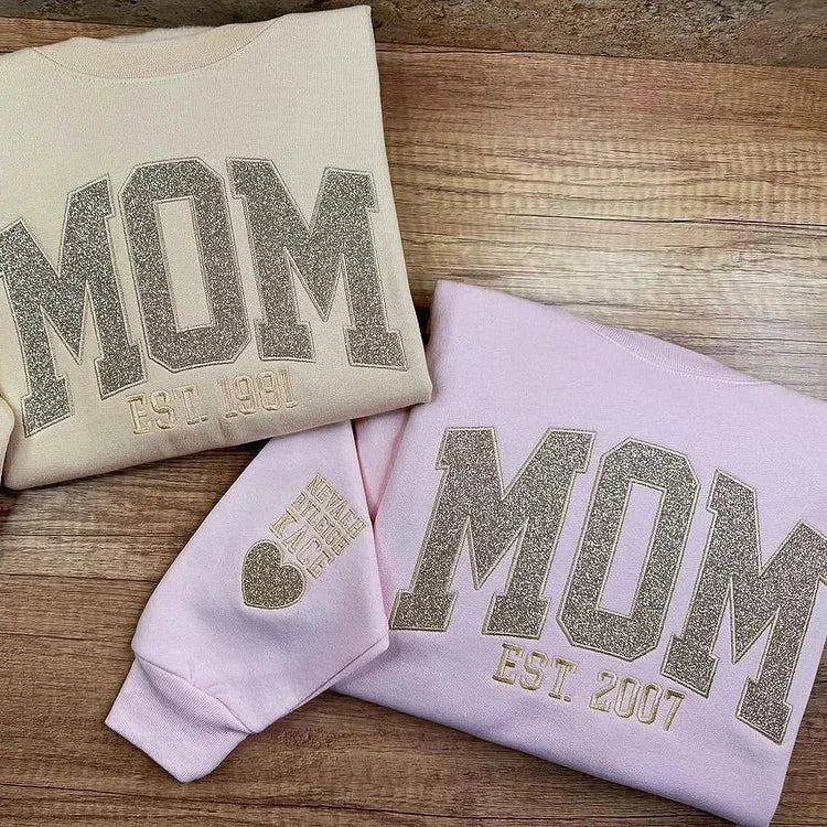 Oblačila z željenim napisom za starše